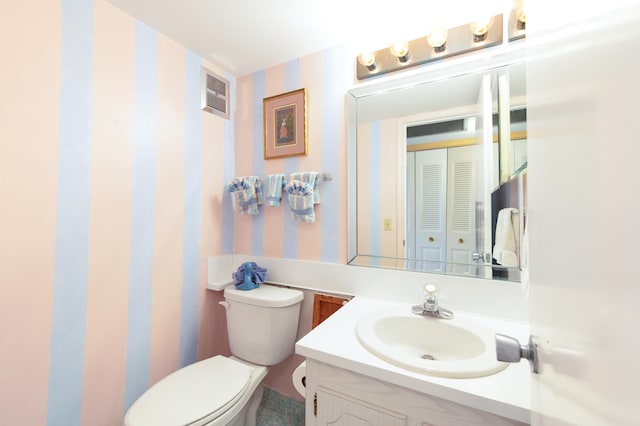 bathroom with vanity and toilet