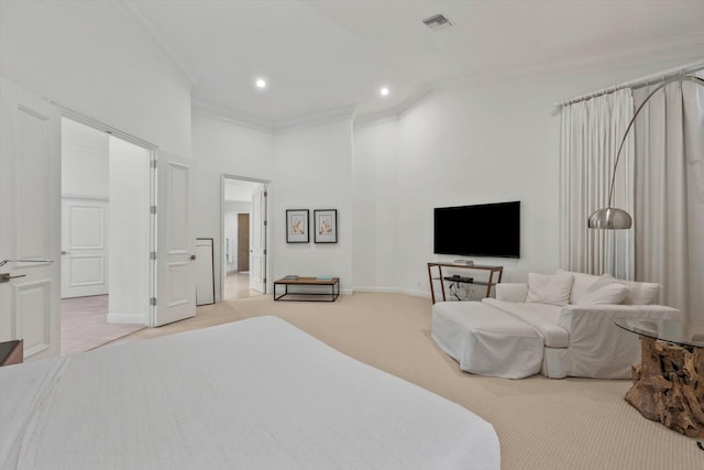 bedroom with light colored carpet, ornamental molding, and a high ceiling