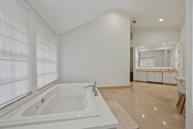 bathroom featuring crown molding, a bathtub, and vanity