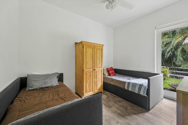 bedroom featuring wood-type flooring and ceiling fan