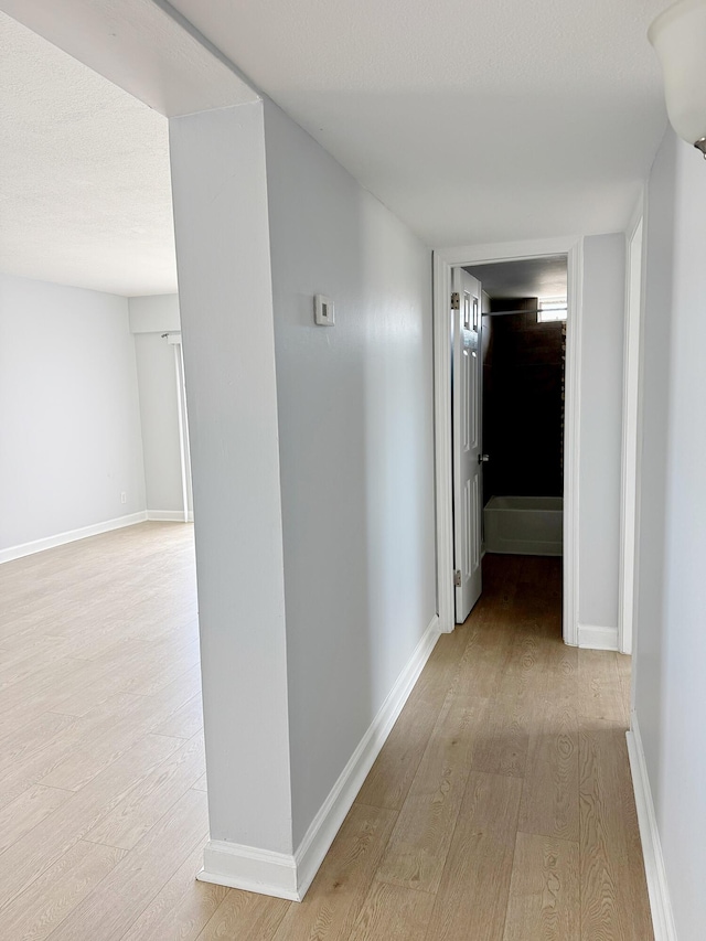 hallway featuring light wood-type flooring