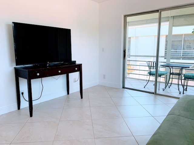 tiled living room with a healthy amount of sunlight