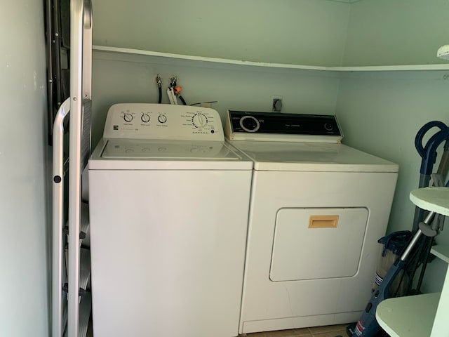 washroom with washing machine and clothes dryer