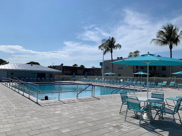 view of swimming pool with a patio area