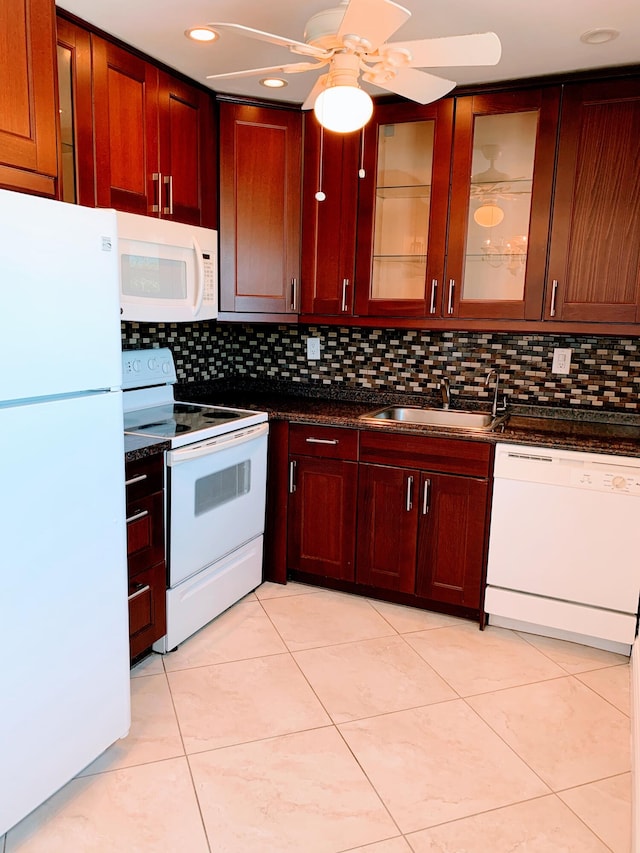 kitchen featuring ceiling fan, white appliances, light tile floors, and tasteful backsplash