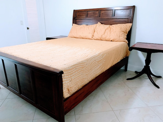 bedroom with light tile flooring