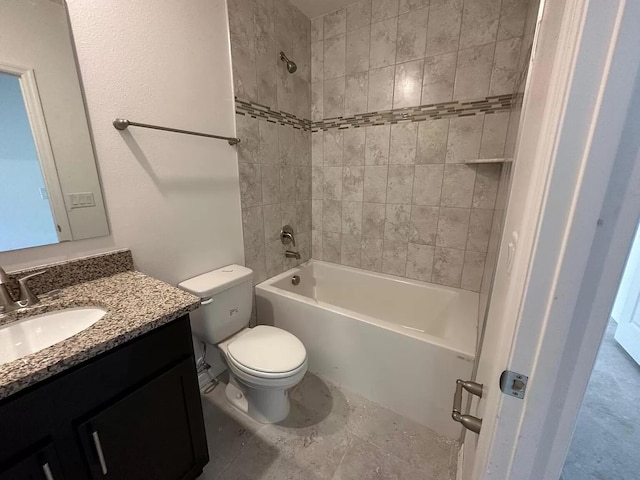 full bathroom featuring tile floors, toilet, vanity, and tiled shower / bath