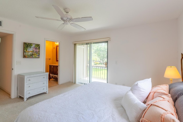 carpeted bedroom featuring access to exterior, ensuite bath, and ceiling fan