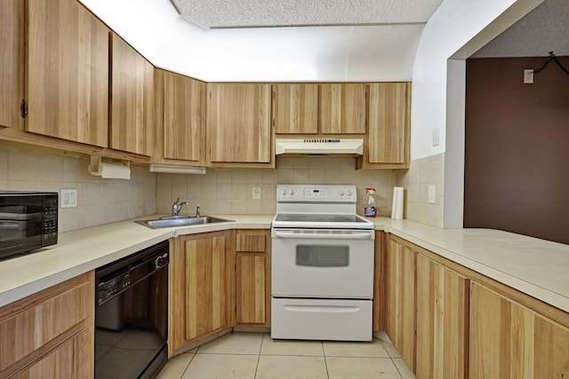 kitchen with light tile flooring, black appliances, backsplash, wall chimney range hood, and sink