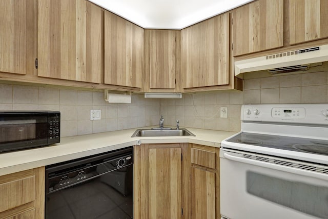 kitchen featuring light brown cabinets, tasteful backsplash, black appliances, custom range hood, and sink