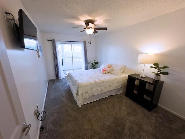 carpeted bedroom featuring a textured ceiling and ceiling fan