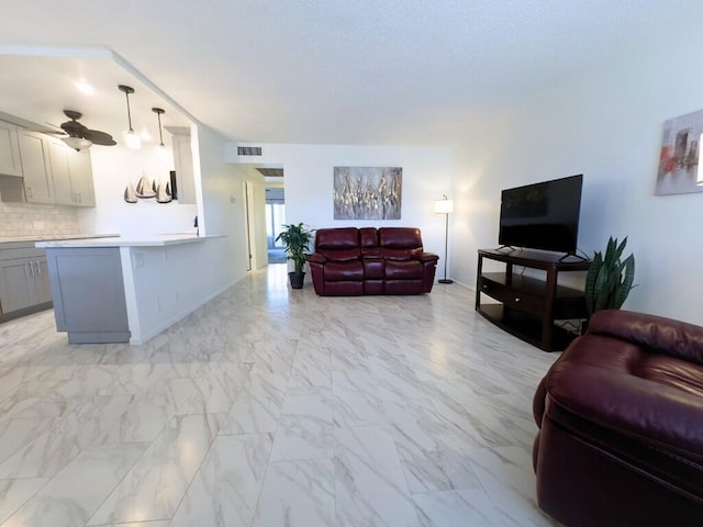 living room with ceiling fan