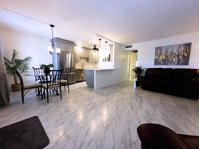 living room featuring a notable chandelier