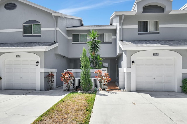 multi unit property featuring a garage