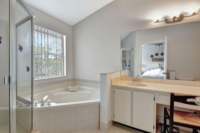 full bathroom with separate shower and tub, toilet, tile floors, vanity, and lofted ceiling