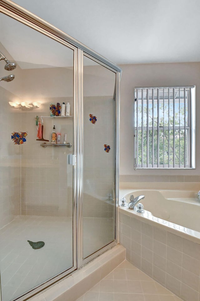 bathroom featuring tile floors and shower with separate bathtub