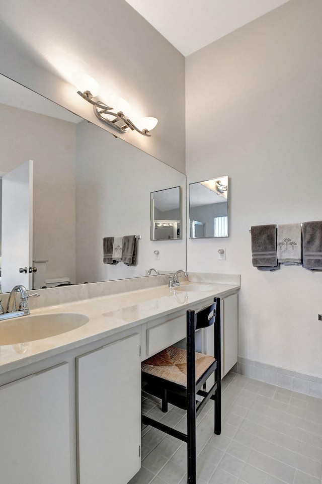 bathroom with tile floors and double sink vanity