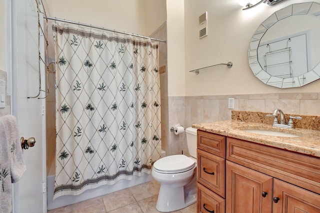 bathroom with tile walls, backsplash, tile floors, toilet, and large vanity