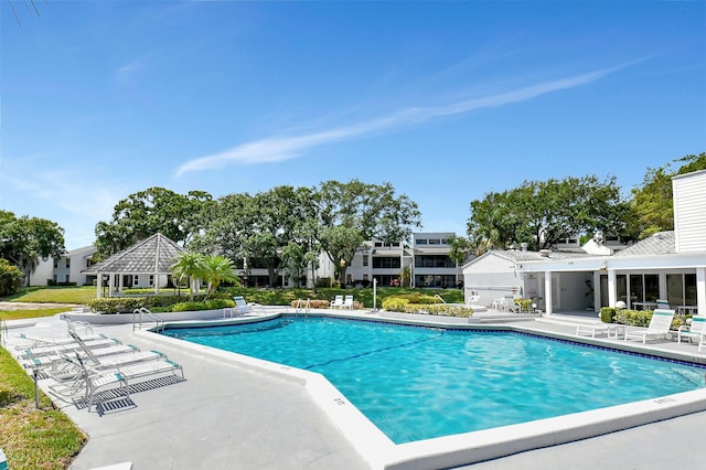 view of swimming pool with a patio area