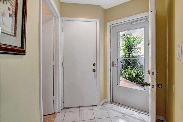 doorway featuring light tile floors