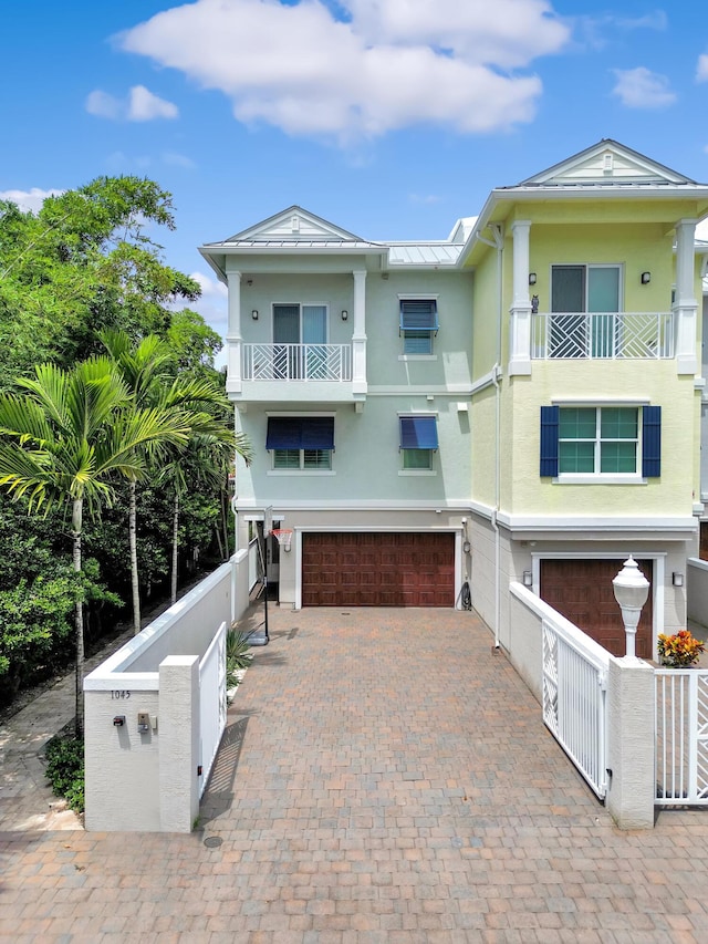 view of front of house with a balcony and a garage