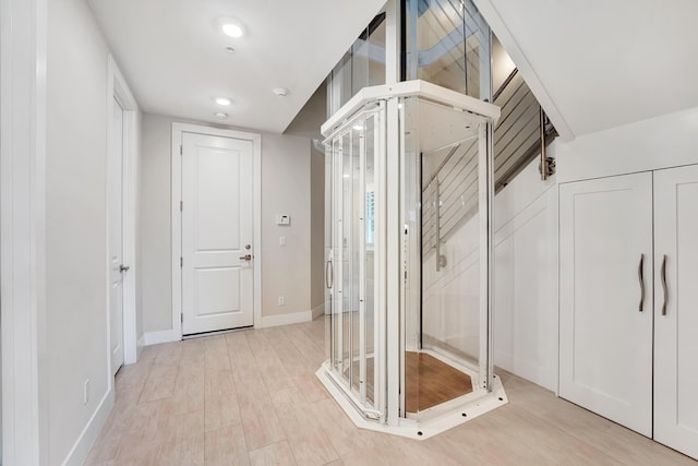 corridor featuring light hardwood / wood-style flooring