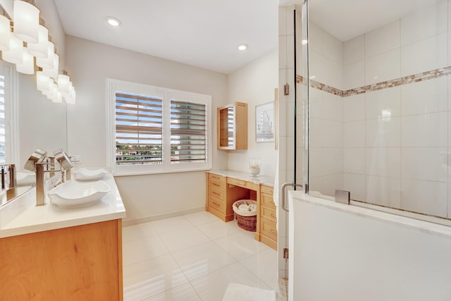 bathroom featuring tile patterned flooring, vanity, and a shower with shower door