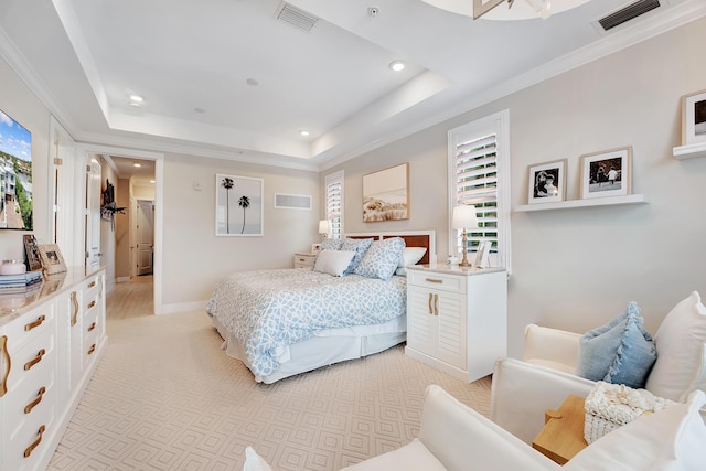 carpeted bedroom with a raised ceiling and crown molding