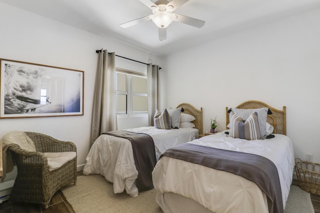 bedroom featuring hardwood / wood-style flooring and ceiling fan