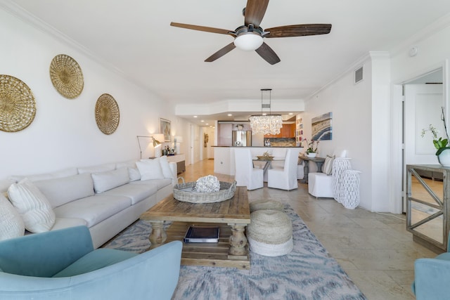 living room featuring ceiling fan with notable chandelier and ornamental molding