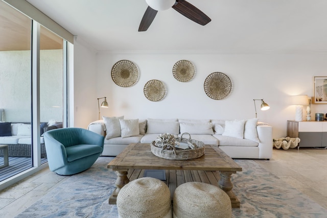 living room with expansive windows, ceiling fan, and ornamental molding