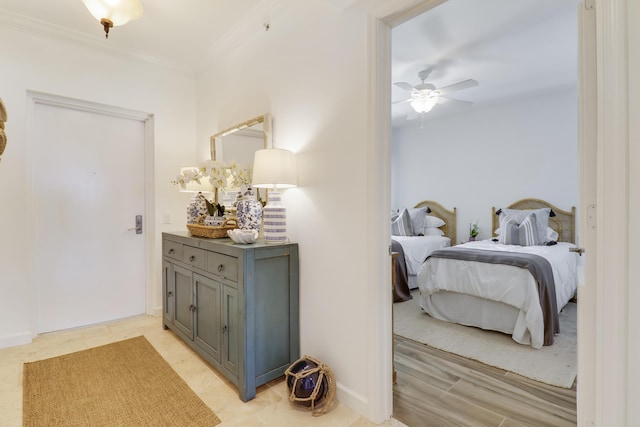 hall with light hardwood / wood-style flooring and ornamental molding