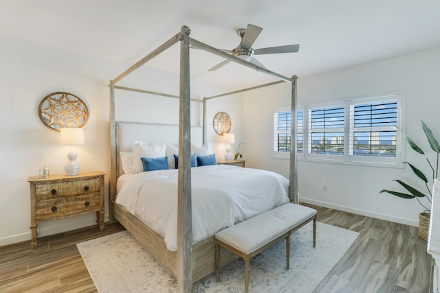 bedroom featuring ceiling fan and hardwood / wood-style flooring