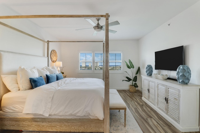 bedroom featuring hardwood / wood-style flooring and ceiling fan