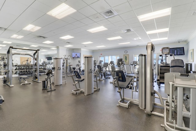 workout area featuring a paneled ceiling