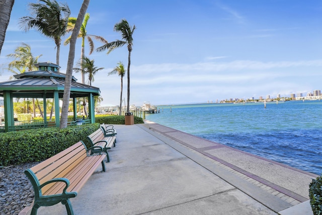 surrounding community with a gazebo and a water view