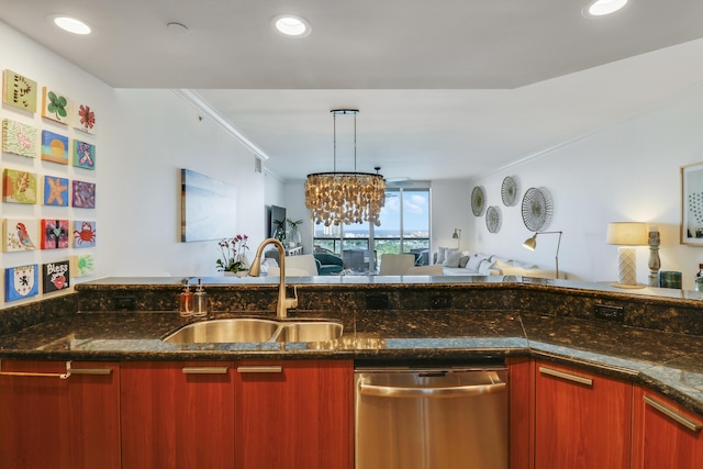 kitchen featuring dishwasher, sink, hanging light fixtures, dark stone countertops, and a chandelier