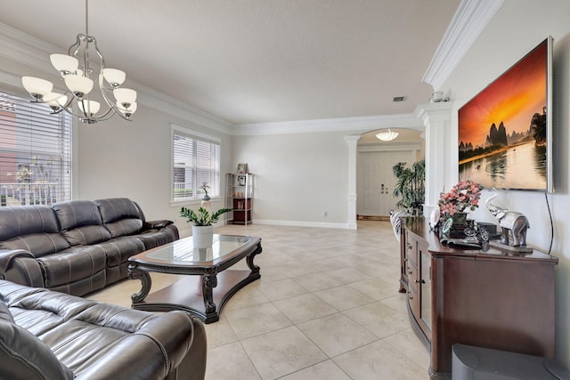 living room featuring ornate columns, crown molding, light tile patterned floors, and a notable chandelier