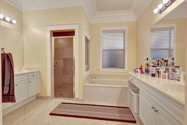 bathroom featuring tile patterned flooring, vanity, ornamental molding, and shower with separate bathtub