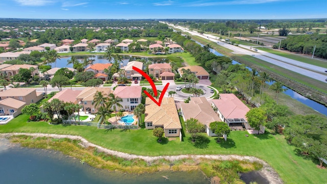 birds eye view of property with a water view