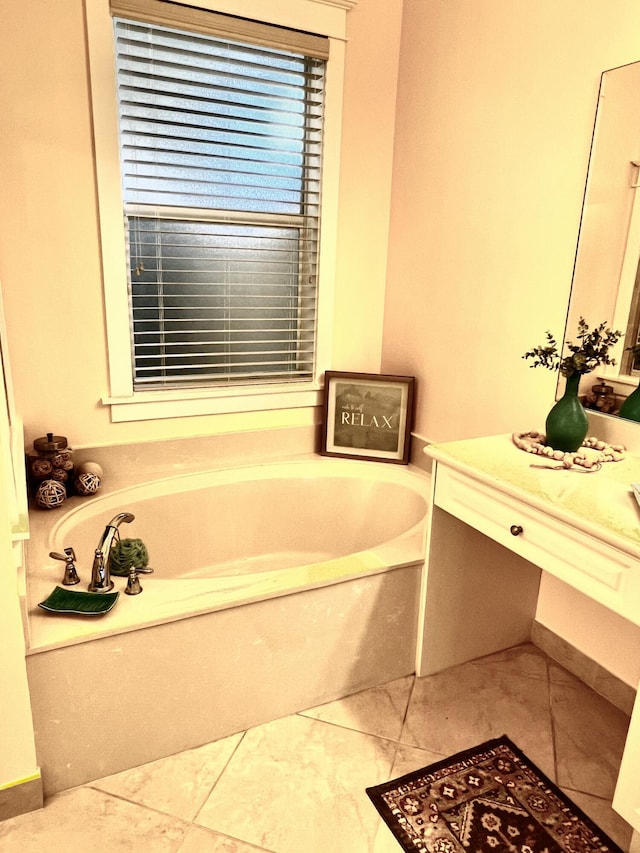 bathroom featuring vanity and a bath