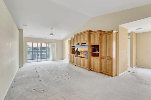 living room with light carpet, ceiling fan, and vaulted ceiling