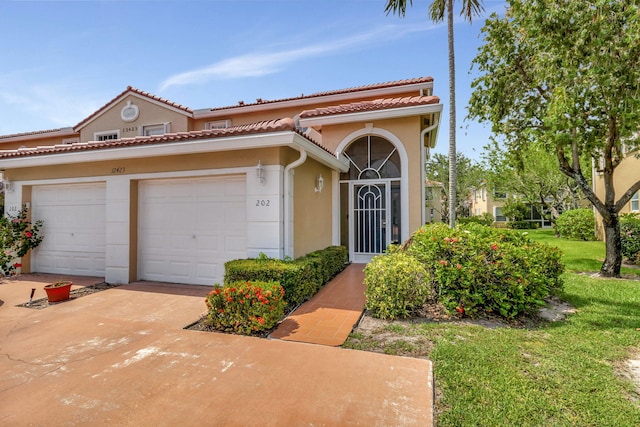 mediterranean / spanish house featuring a front yard