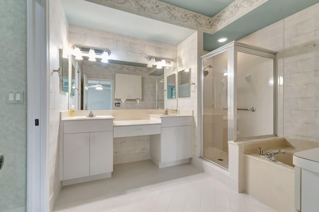 bathroom featuring shower with separate bathtub, double sink vanity, ceiling fan, and tile floors