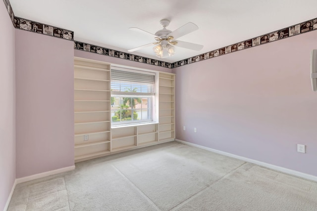 spare room with carpet and ceiling fan