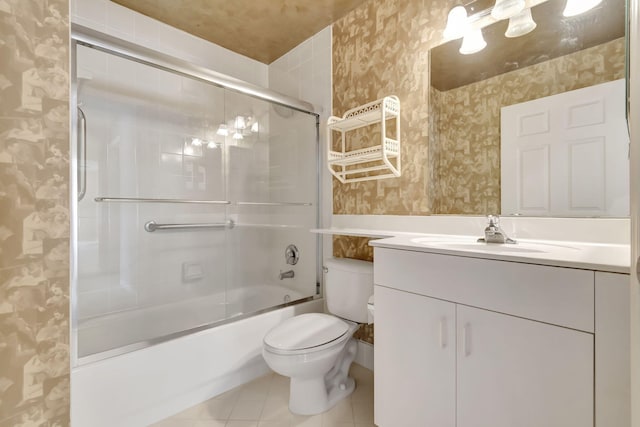 full bathroom with shower / bath combination with glass door, tile flooring, oversized vanity, and toilet