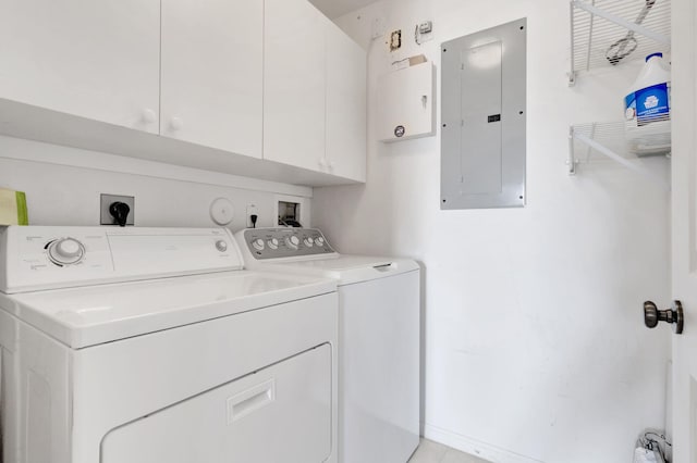 laundry area with washer hookup, washer and clothes dryer, electric dryer hookup, and cabinets