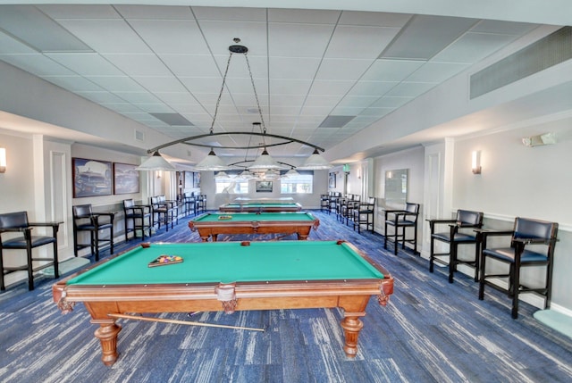 playroom with a paneled ceiling, billiards, and dark colored carpet