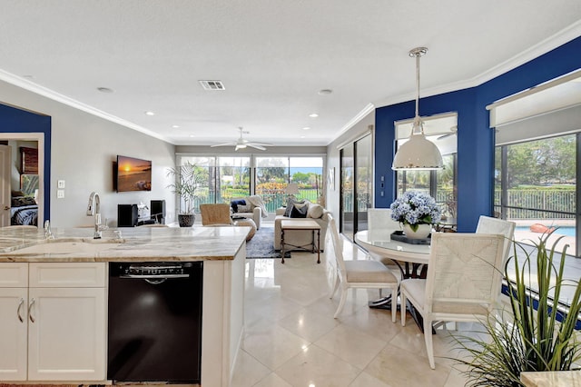 kitchen with black dishwasher, a wealth of natural light, white cabinetry, and decorative light fixtures