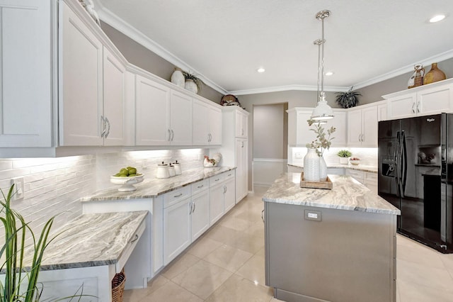 kitchen with white cabinets, a kitchen island, backsplash, black refrigerator with ice dispenser, and decorative light fixtures